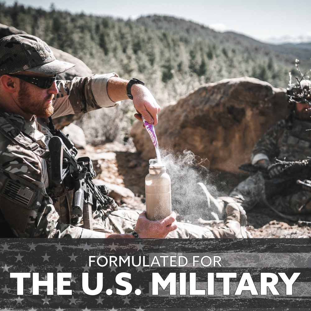 Soldiers in a natural setting with a bottle of a powdered drink mix, labeled 'Formulated for the U.S. Military'.