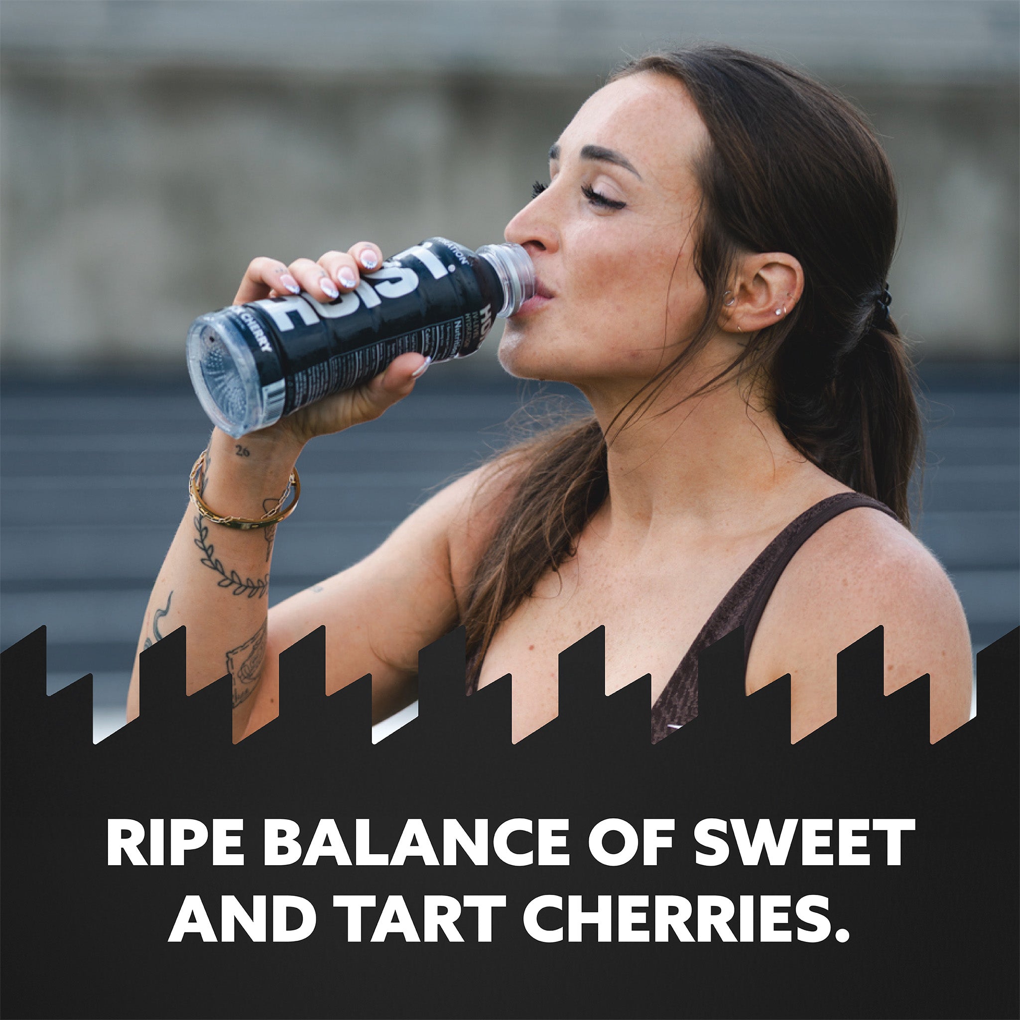 Woman drinking a bottle of Honest with text about cherry flavor.