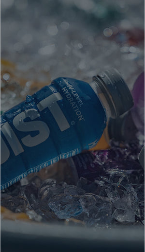 Blue Hoist bottle on ice with blurred background
